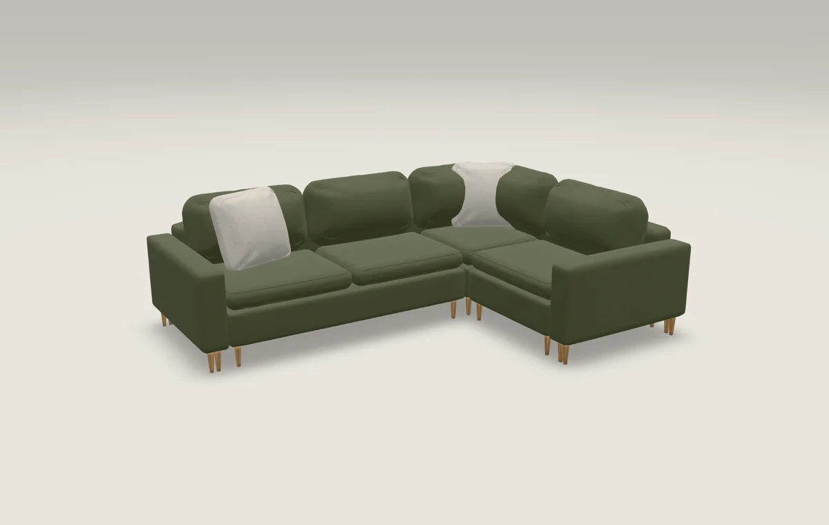 The Mira modular corner sofa in moss wool on oiled oak legs, under showroom lighting, rendered live by huesix